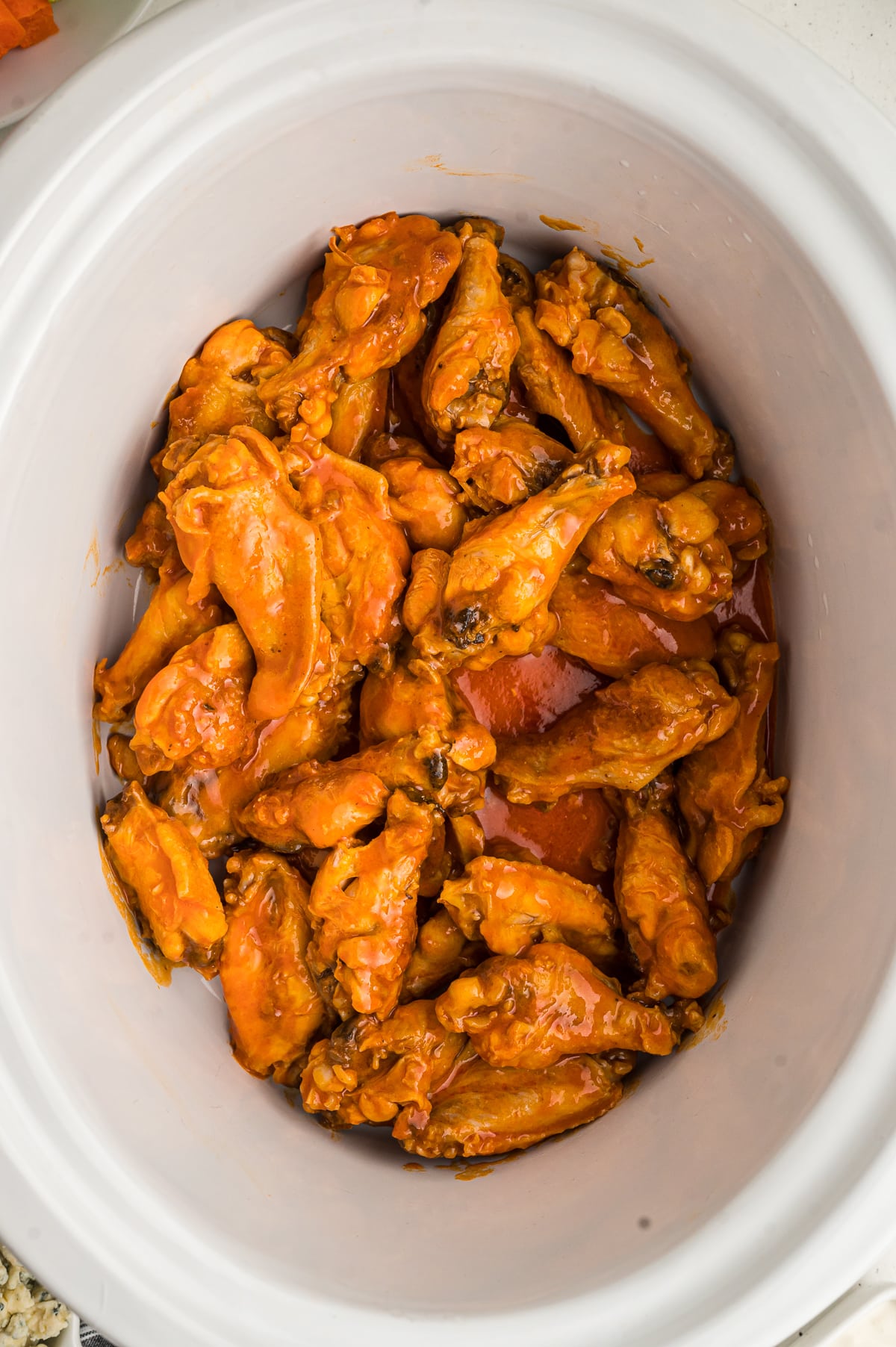 cooked buffalo wings in the crockpot.