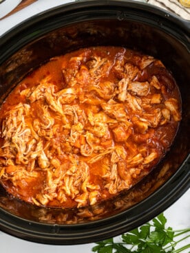 shredded chicken marinara in a slow cooker.