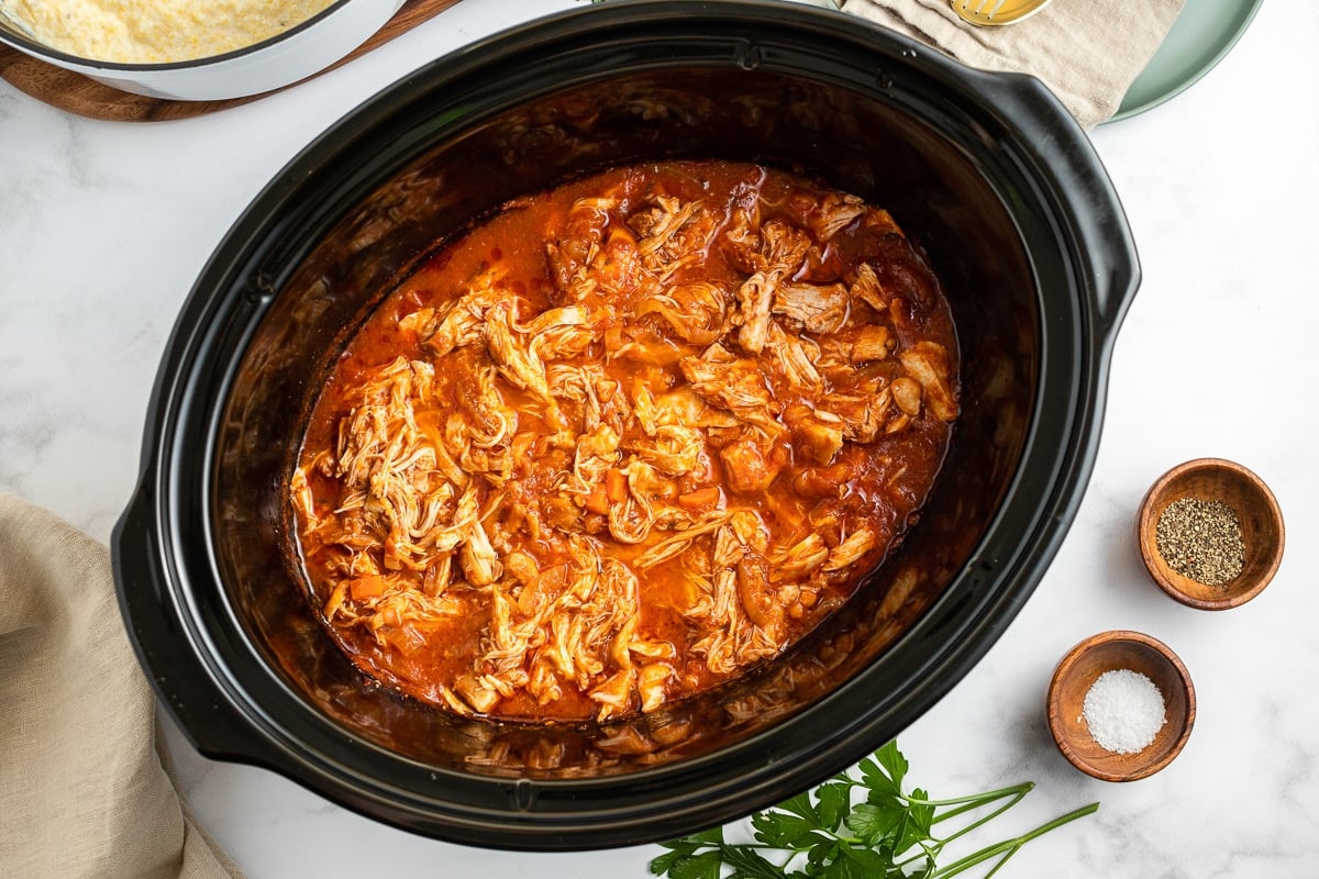 shredded chicken marinara in a slow cooker.