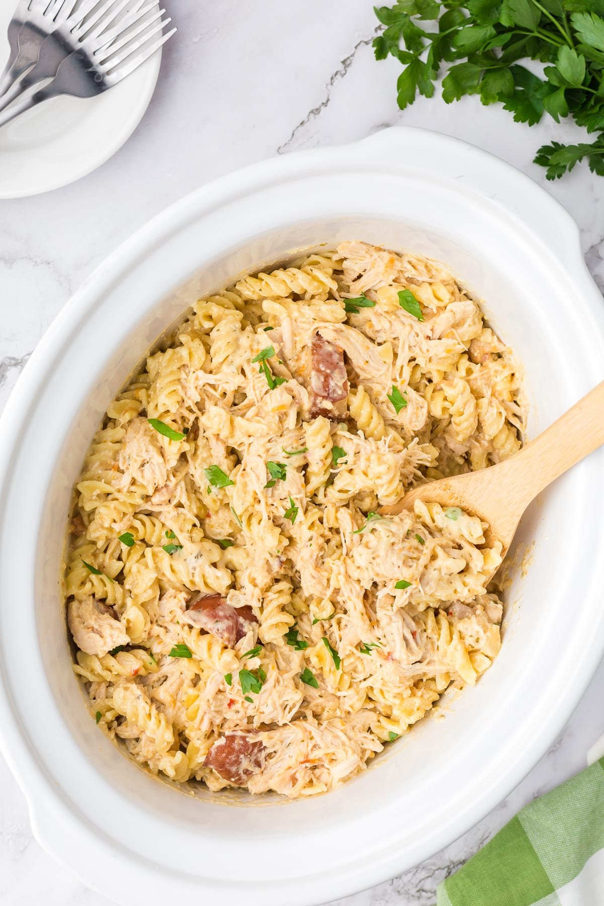 cooked garlic parmesan pasta in a crockpot.