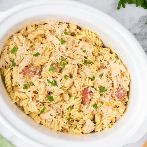 overhead shot of garlic parmesan pasta in a crockpot.