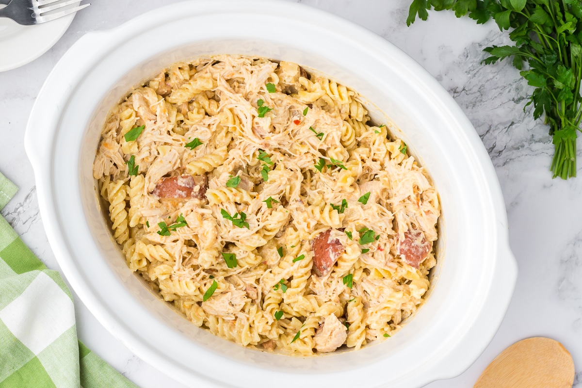 overhead shot of garlic parmesan pasta in a crockpot.