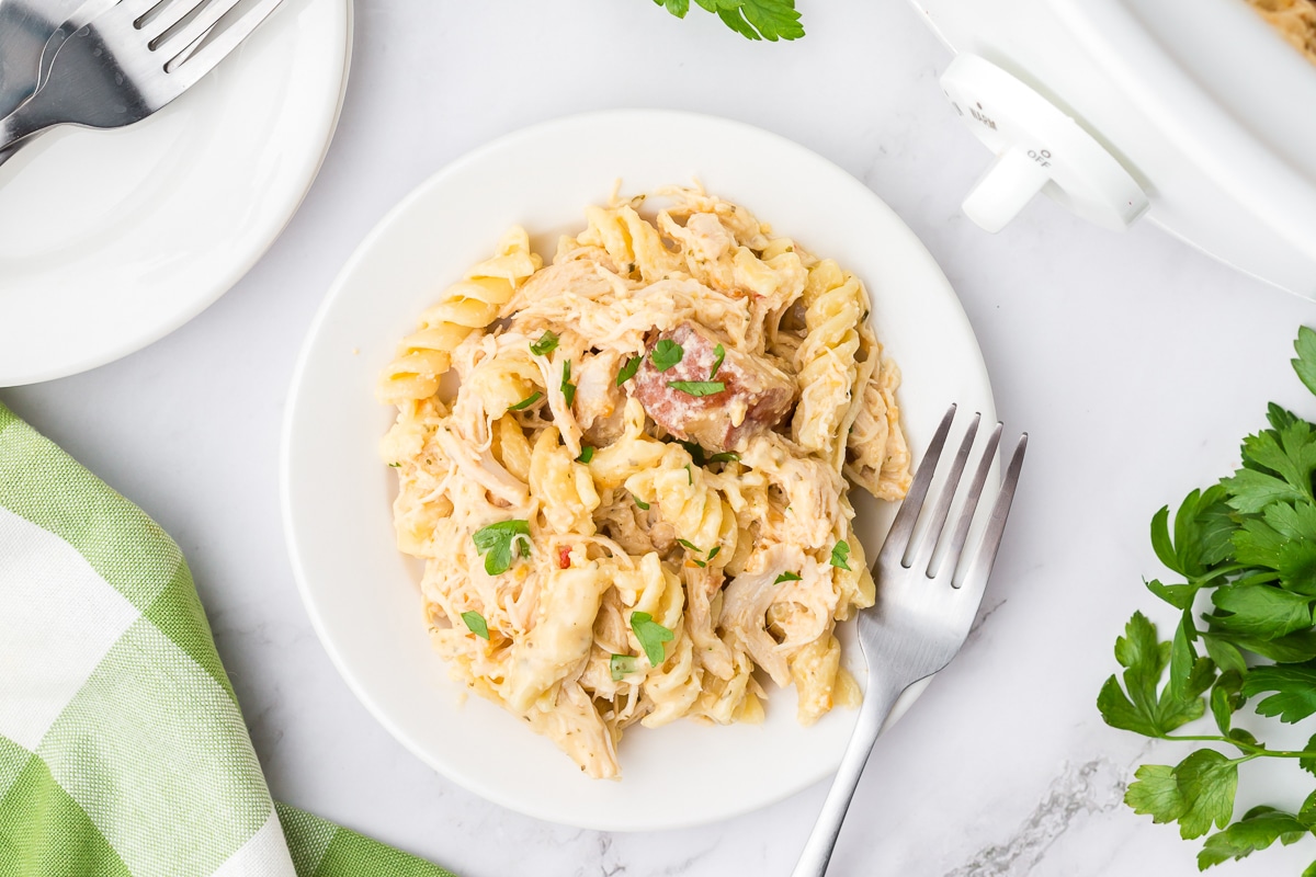 Plate of garlic parmesan pasta with fork on the side.