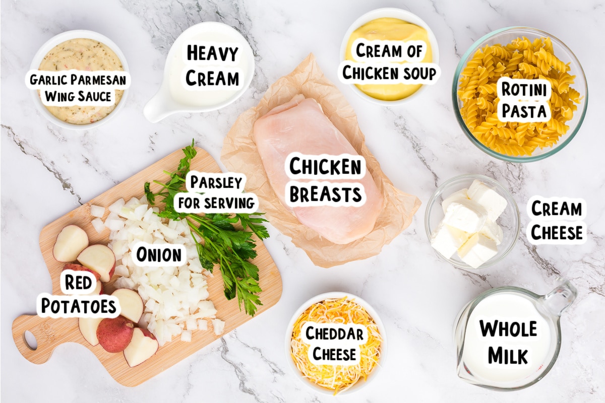 Ingredients for garlic parmesan pasta on a table.