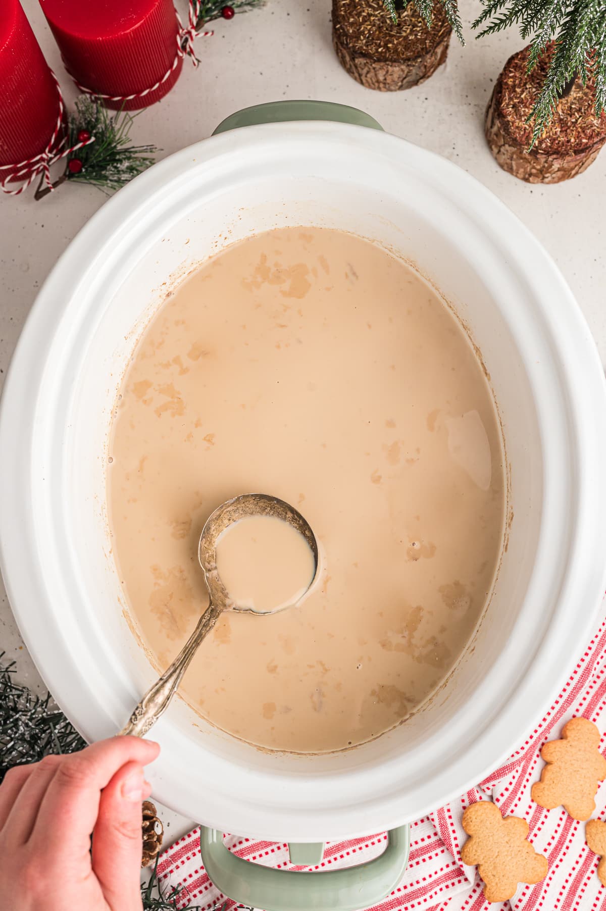 gingerbread lattes in crockpot with spoon in it.