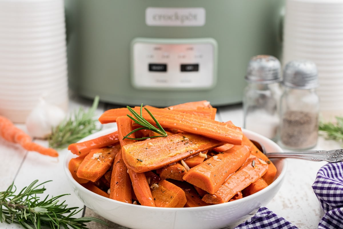 honey garlic carrots in a white bowl.