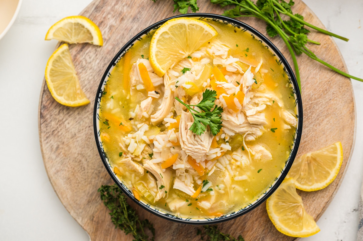 overheard shot of lemon chicken and rice soup in a bowl.