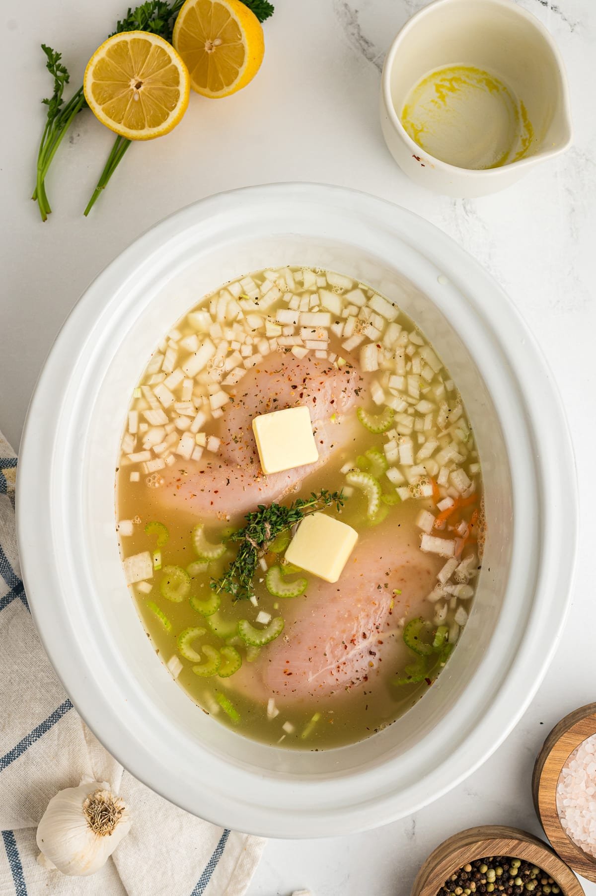 Chicken breasts, in broth, with butter, lemon juice and butter.