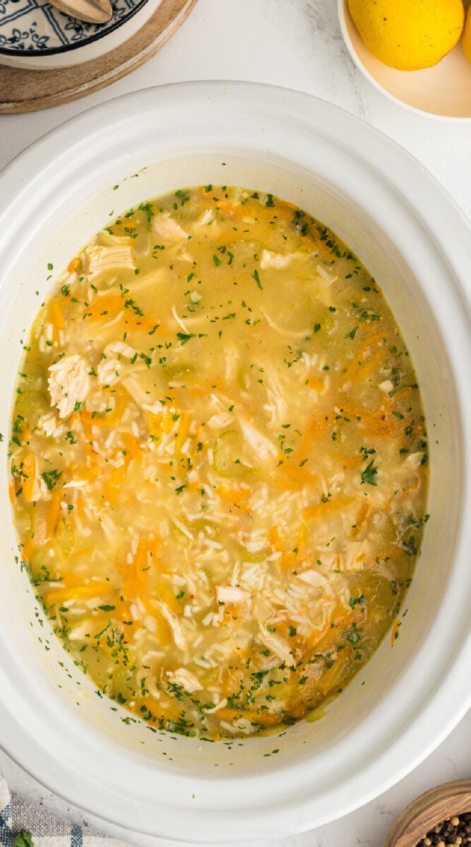 long image of chicken lemon rice soup.