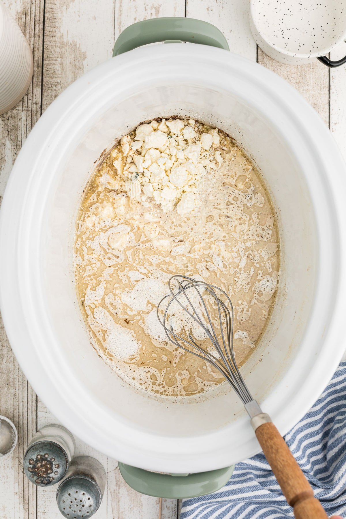 gravy being made in the slow cooker from the drippings.