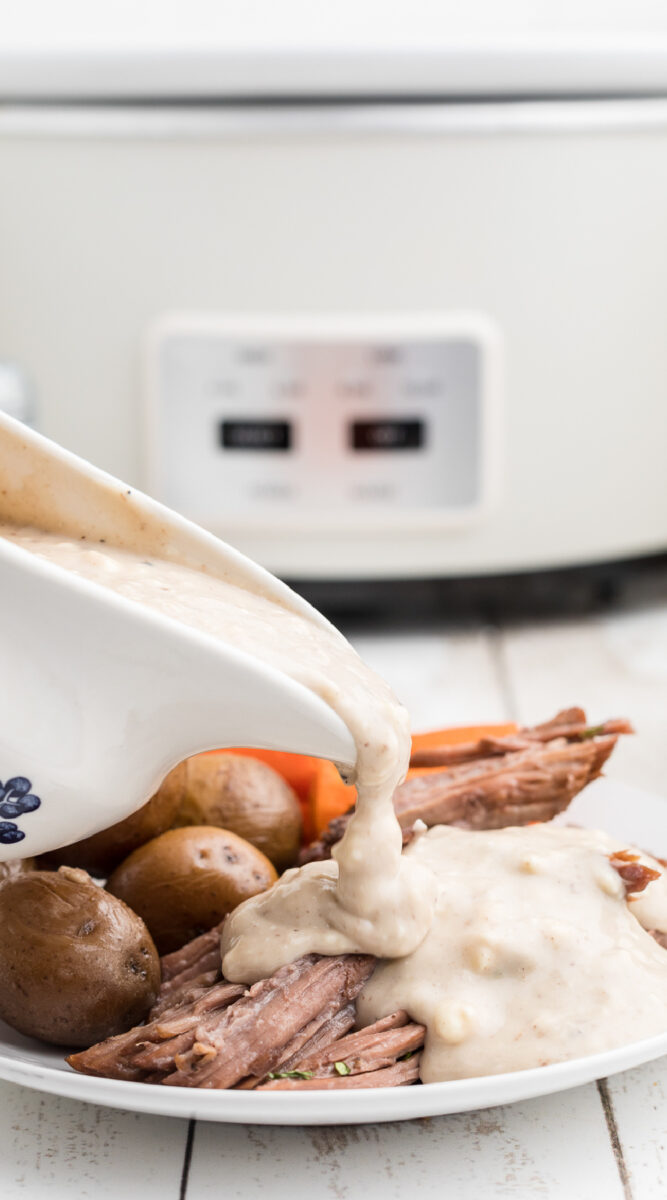 long image of pot roast with blue cheese gravy being poured.