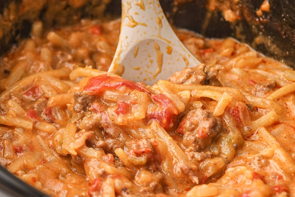 close up of taco casserole with spoon in it.