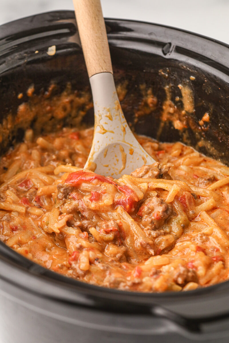 Taco potato casserole with spoon in it.