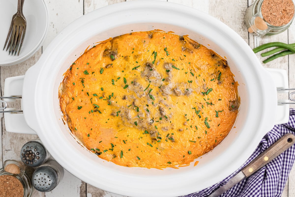 Overhead shot of tater tot casserole in slow cooker.