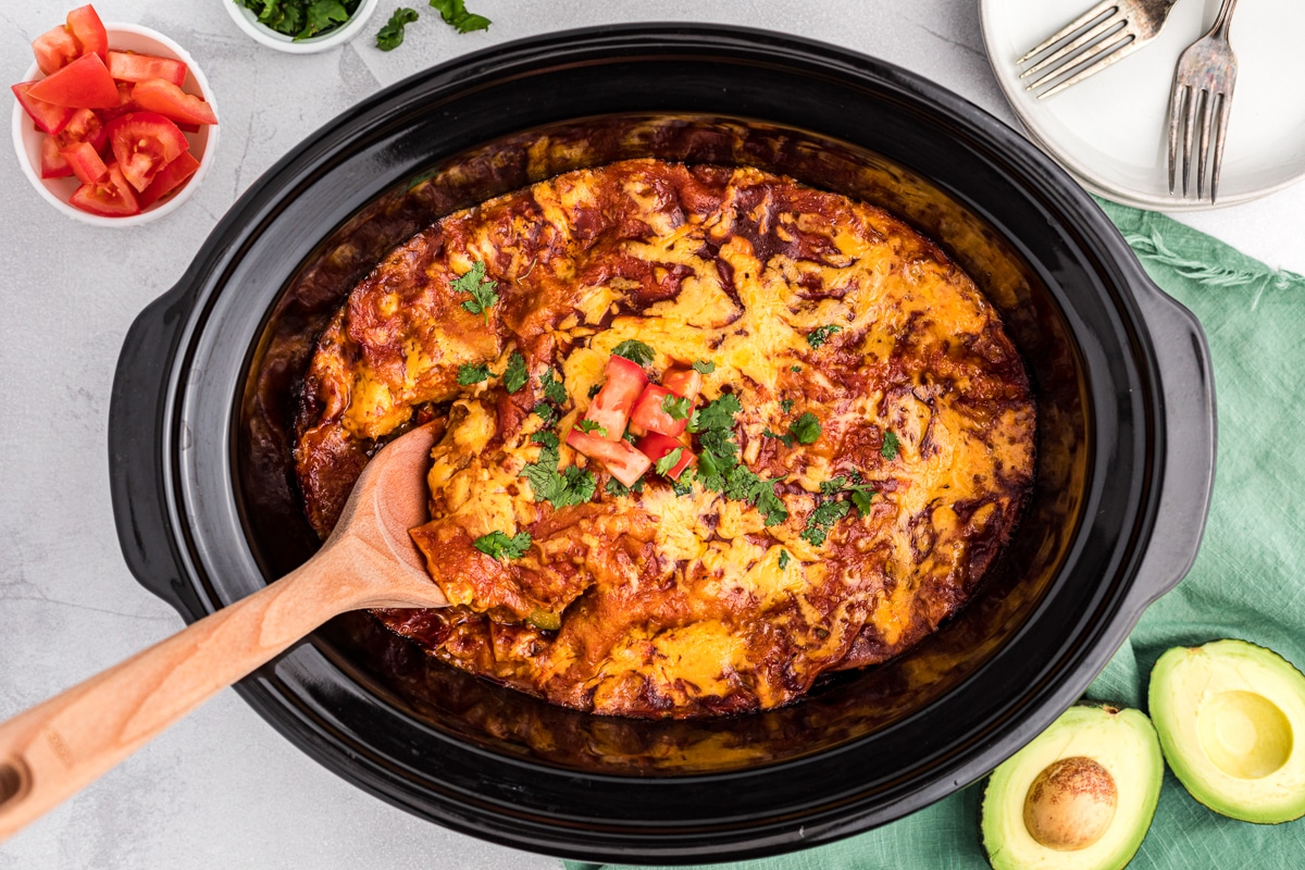 overhead shot of vegetable enchiladas in crockpot.