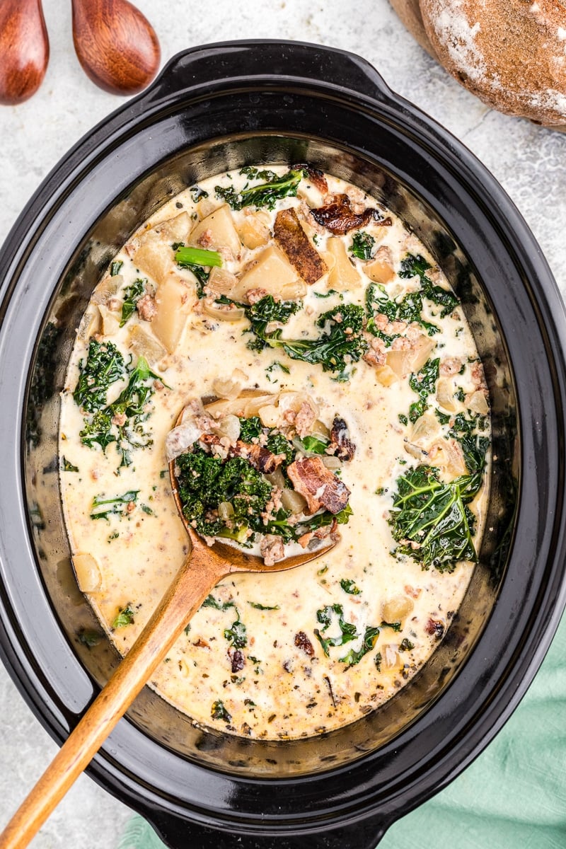 cooked zuppa toscana with spoon in it.