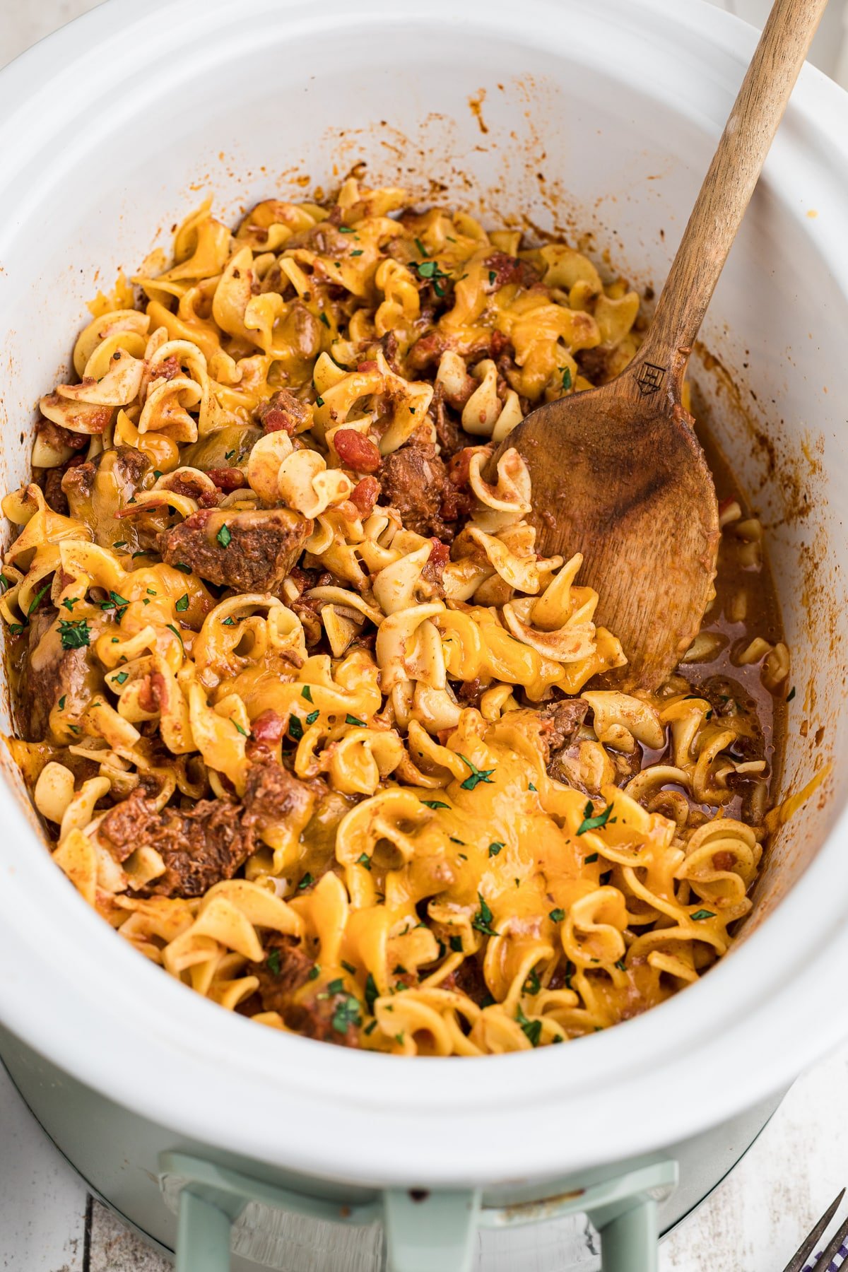 Cooked beef noodle casserole in a crockpot.