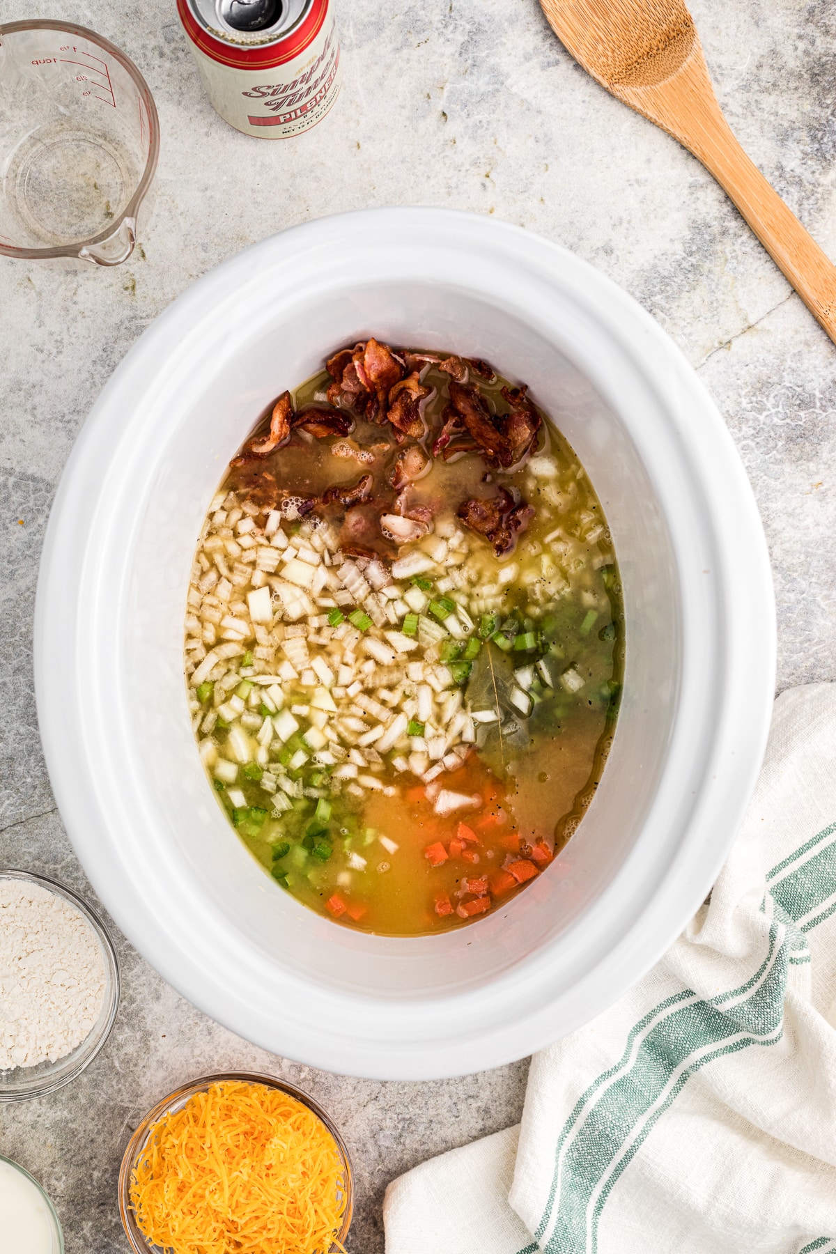 veggies, bacon, beer and bacon and chicken stock in the slow cooker.