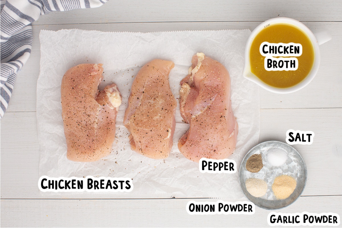 Ingredients for chicken breasts on a table.