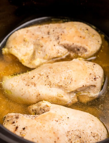 Chicken breasts cooked in a crockpot.