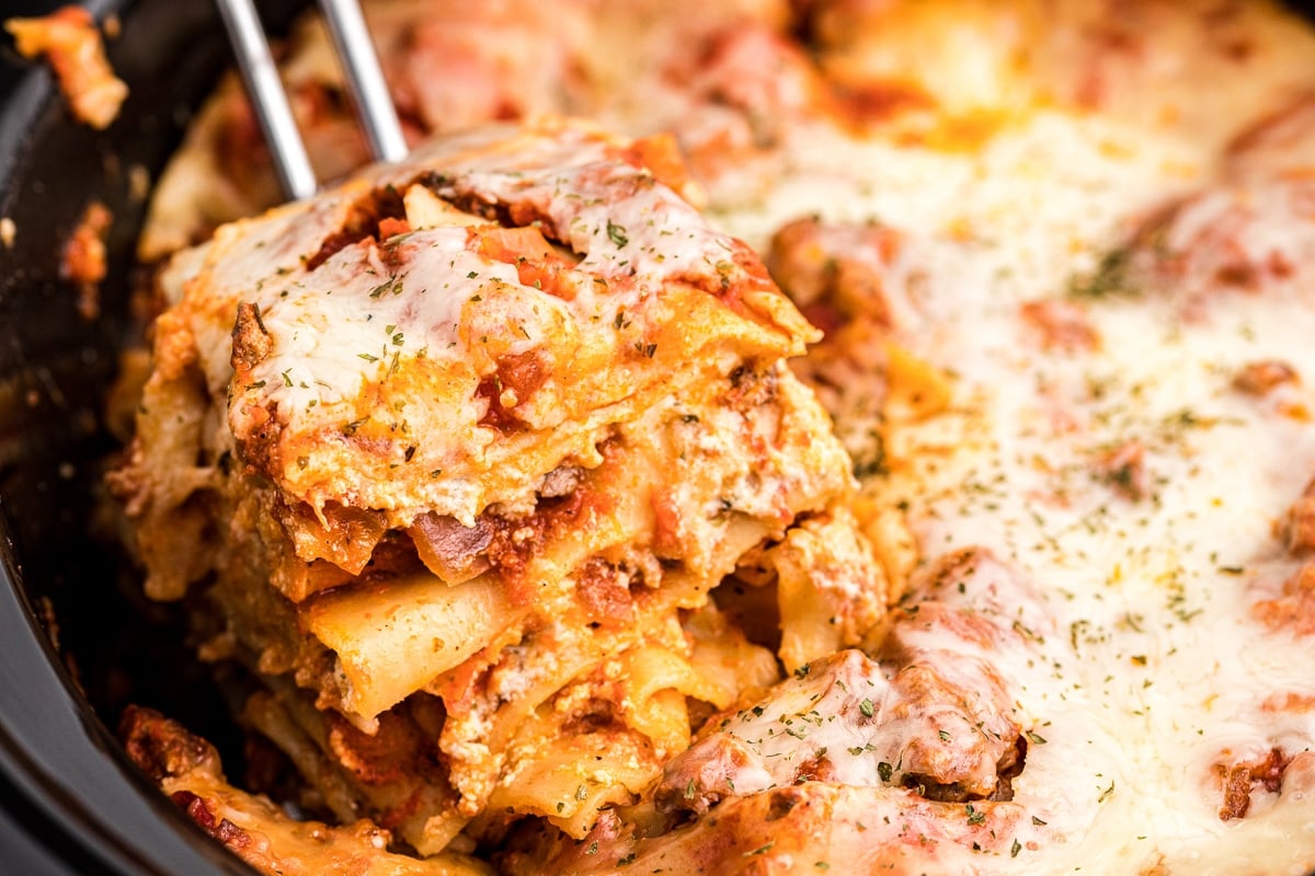 Close up of lasagna on a spatula.