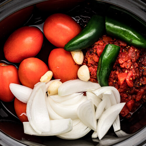 ingredients for salsa in a crockpot.