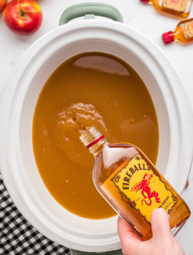 fireball being poured into apple cider.