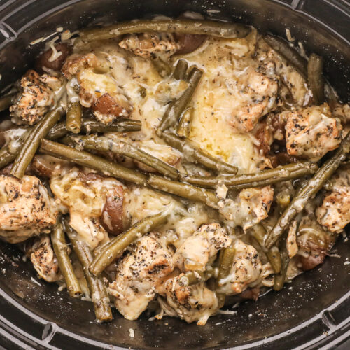 close up of cooked garlic parmesan chicken and potatoes.