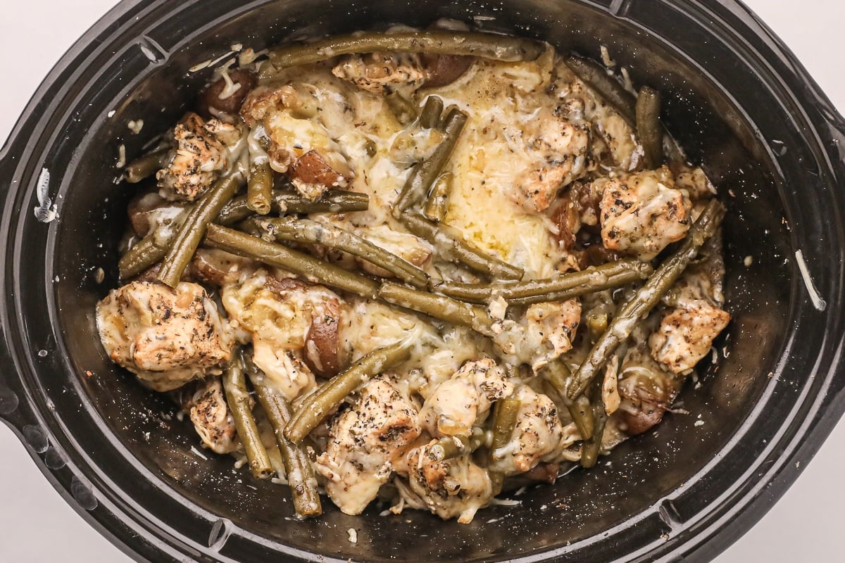 close up of cooked garlic parmesan chicken and potatoes.