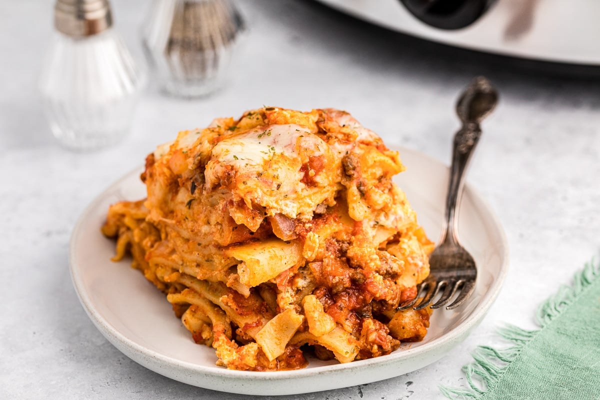 plate of crock pot lasagna with fork in it.