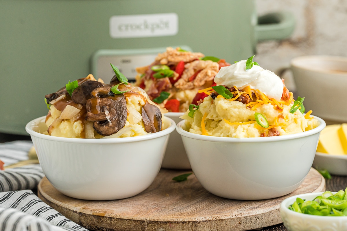 bowls of mashed potatoes with deluxe toppings.