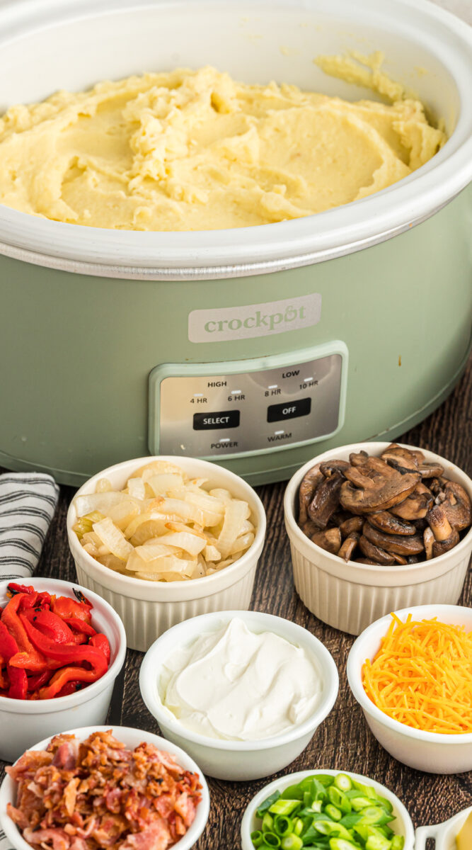 long image of crockpot mashed potato bar.