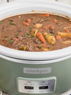 Side view of venison stew in a crock pot.