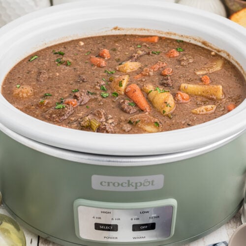 Side view of venison stew in a crock pot.