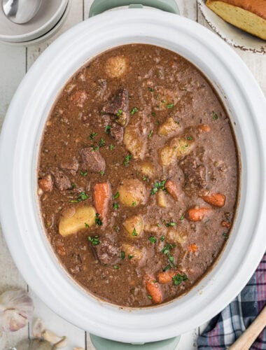 Cooked venison stew in a slow cooker.