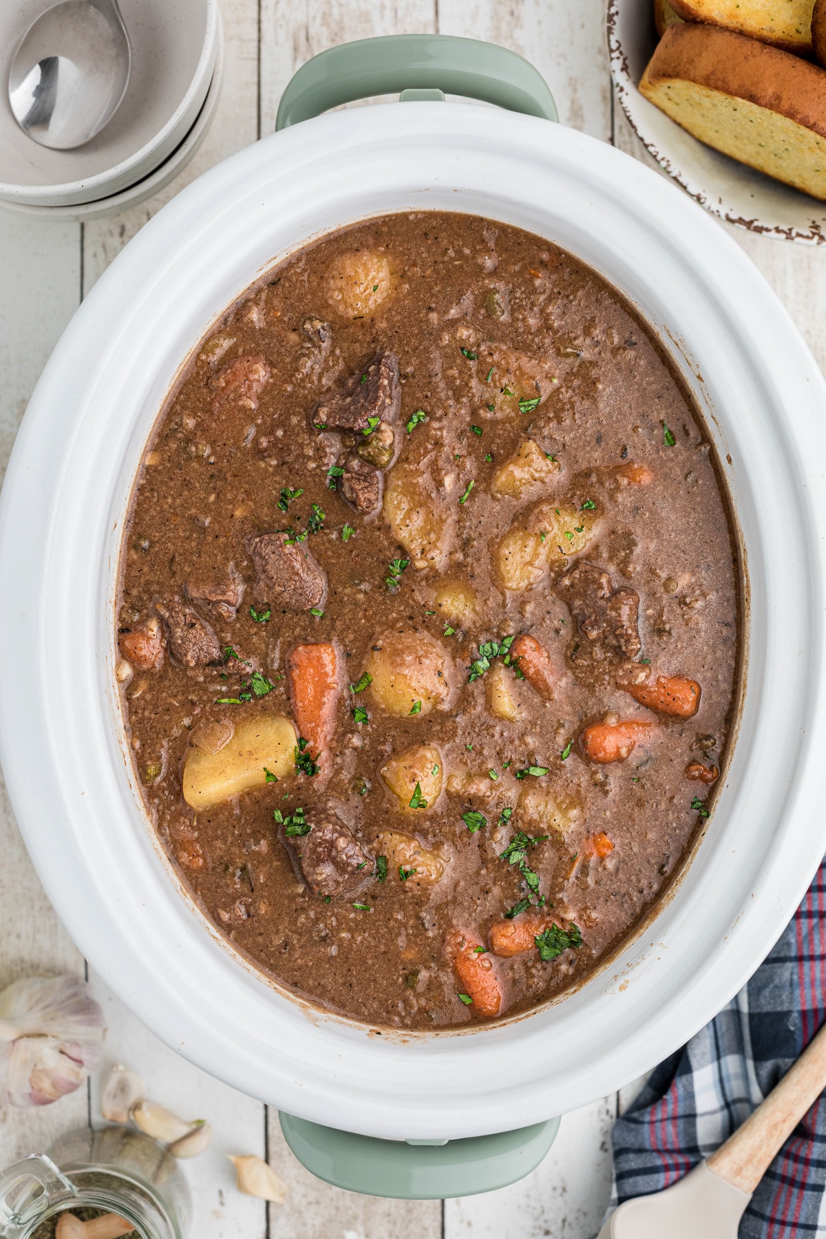 Cooked venison stew in a slow cooker.