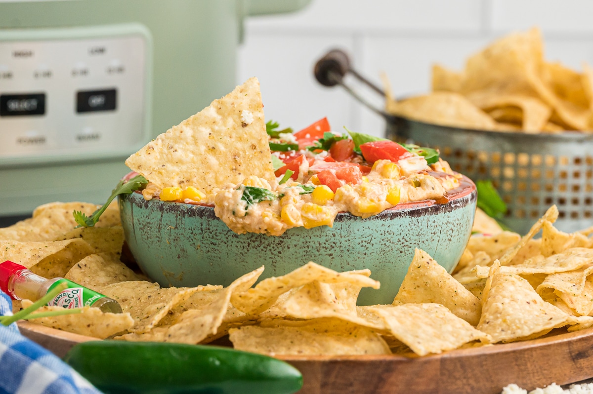 corn dip in a green bowl.