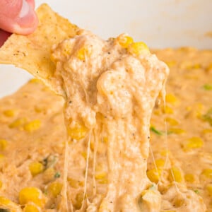 Cheesy corn dip on a chip.