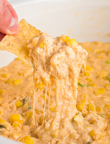 Cheesy corn dip on a chip.