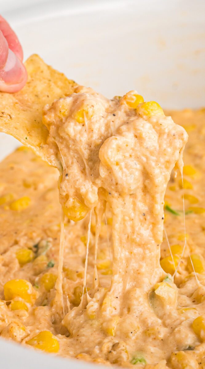 long image of corn dip on a chip for pinterest.