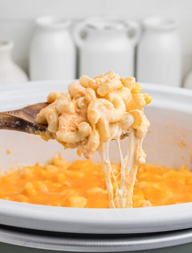 crockpot mac and cheese on a spoon.