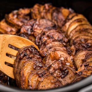 Cooked lipton onion potatoes on a wooden spoon