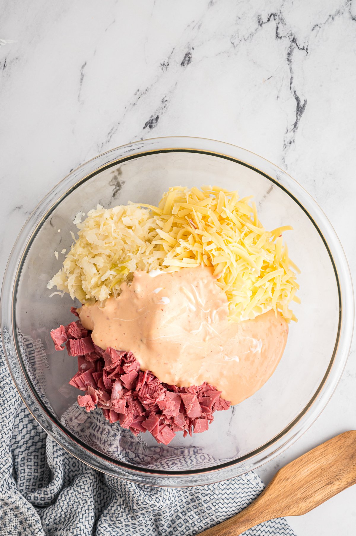 Cheeses, thousand island, pastrami in a bowl.