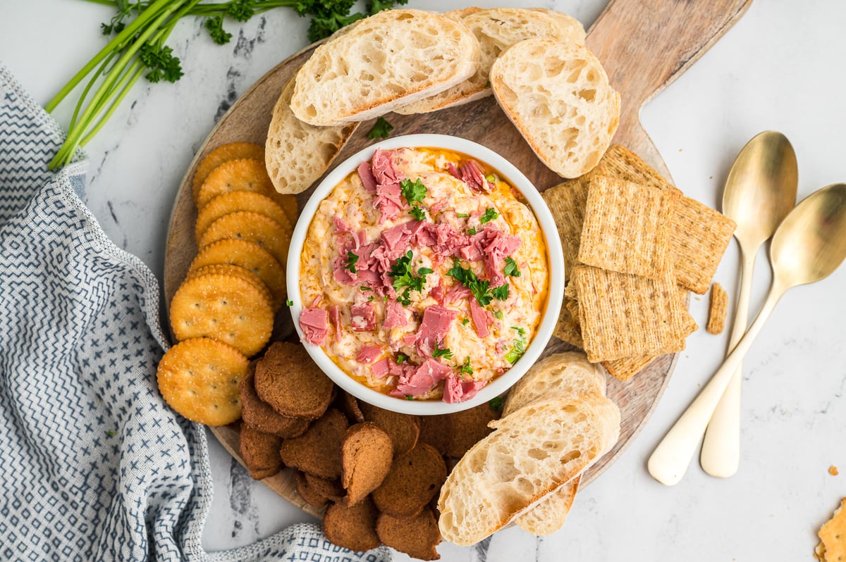 Overhead image of reuben dip with crackers and bread.