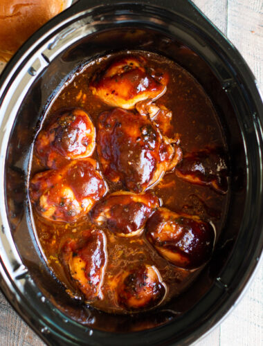 Root beer chicken thighs in a crockpot.