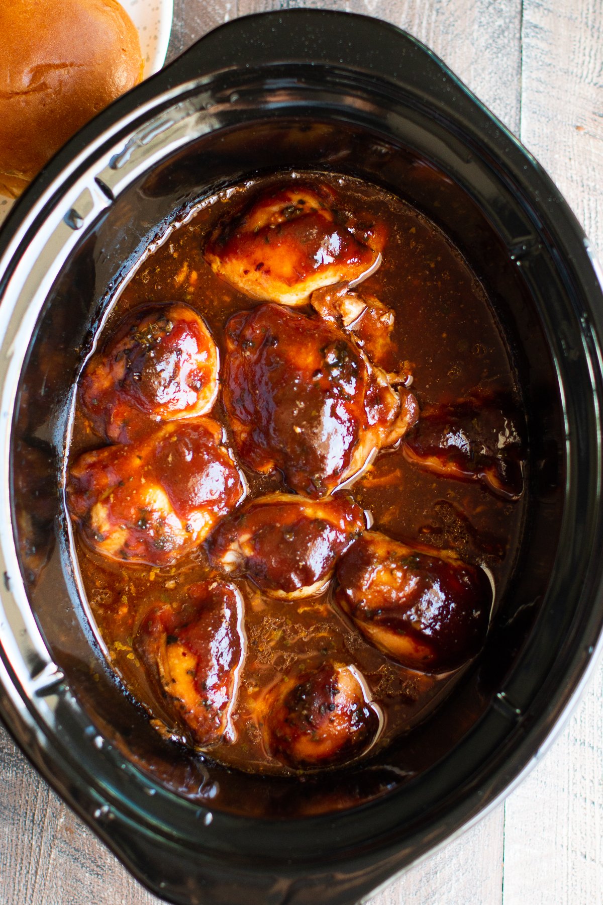 Root beer chicken thighs in a crockpot.