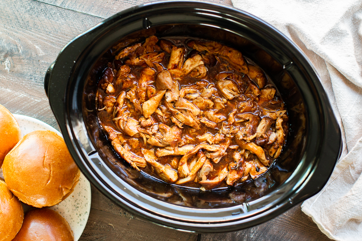 shredded root beer chicken in a slow cooker.