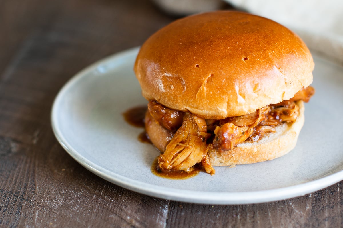 root beer chicken sandwich on a plate.