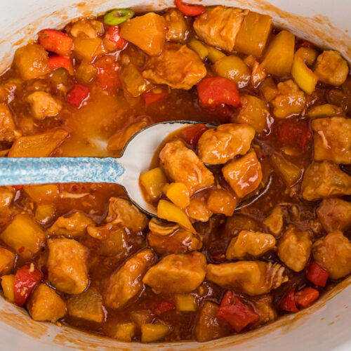 spoon in sweet and sour chicken.