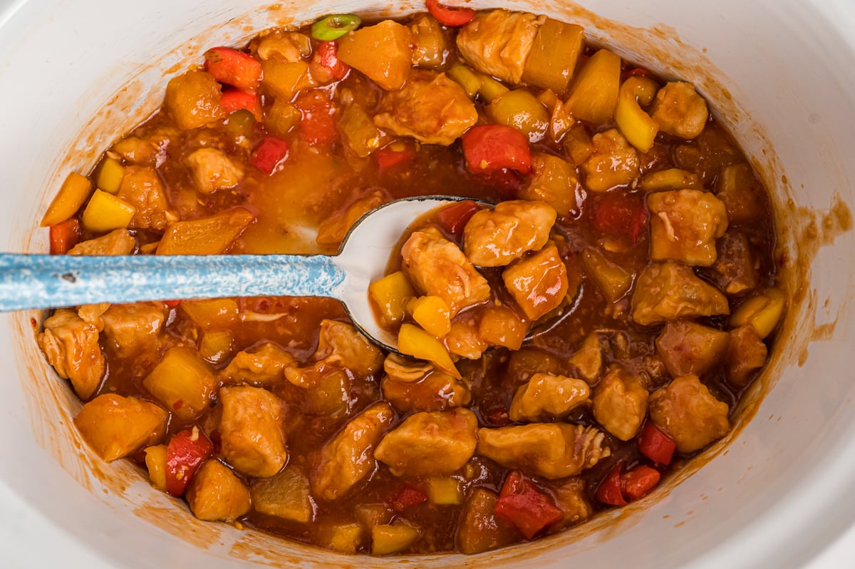 spoon in sweet and sour chicken.